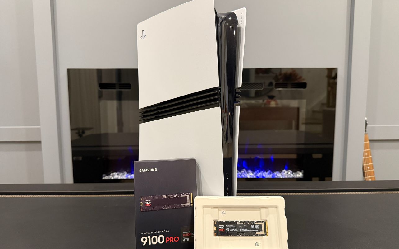 The Samsung 9100 Pro SSD is in front of the PS5 Pro gaming console, ready for installation.