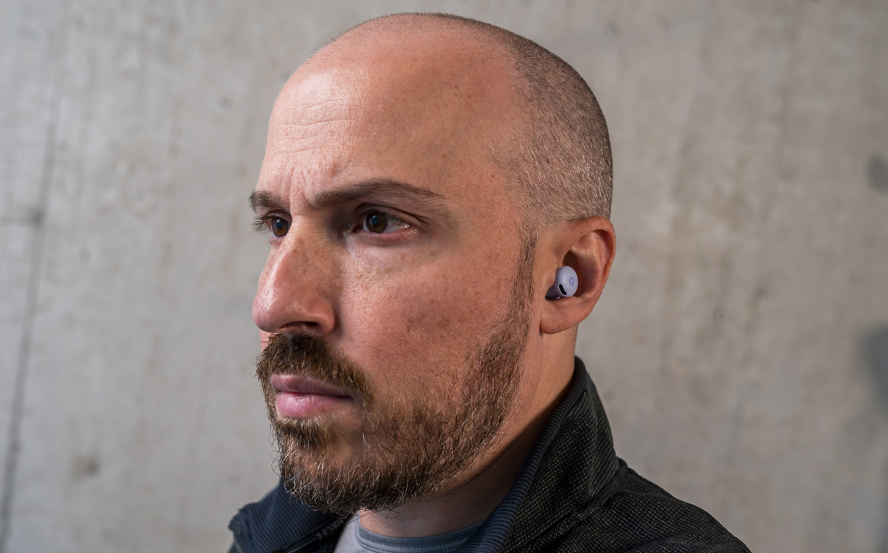 Wearing the Google Pixel Buds 2a earbuds.