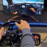 Racing Sim Banner with hands on wheel.