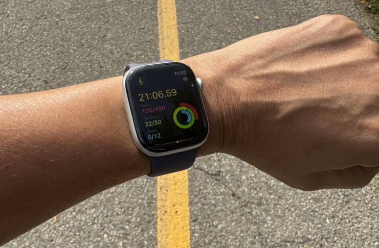 Is the Apple Watch Series 11 worth the upgrade? Apple Watch Series 11 on a wrist logging a walking workout.