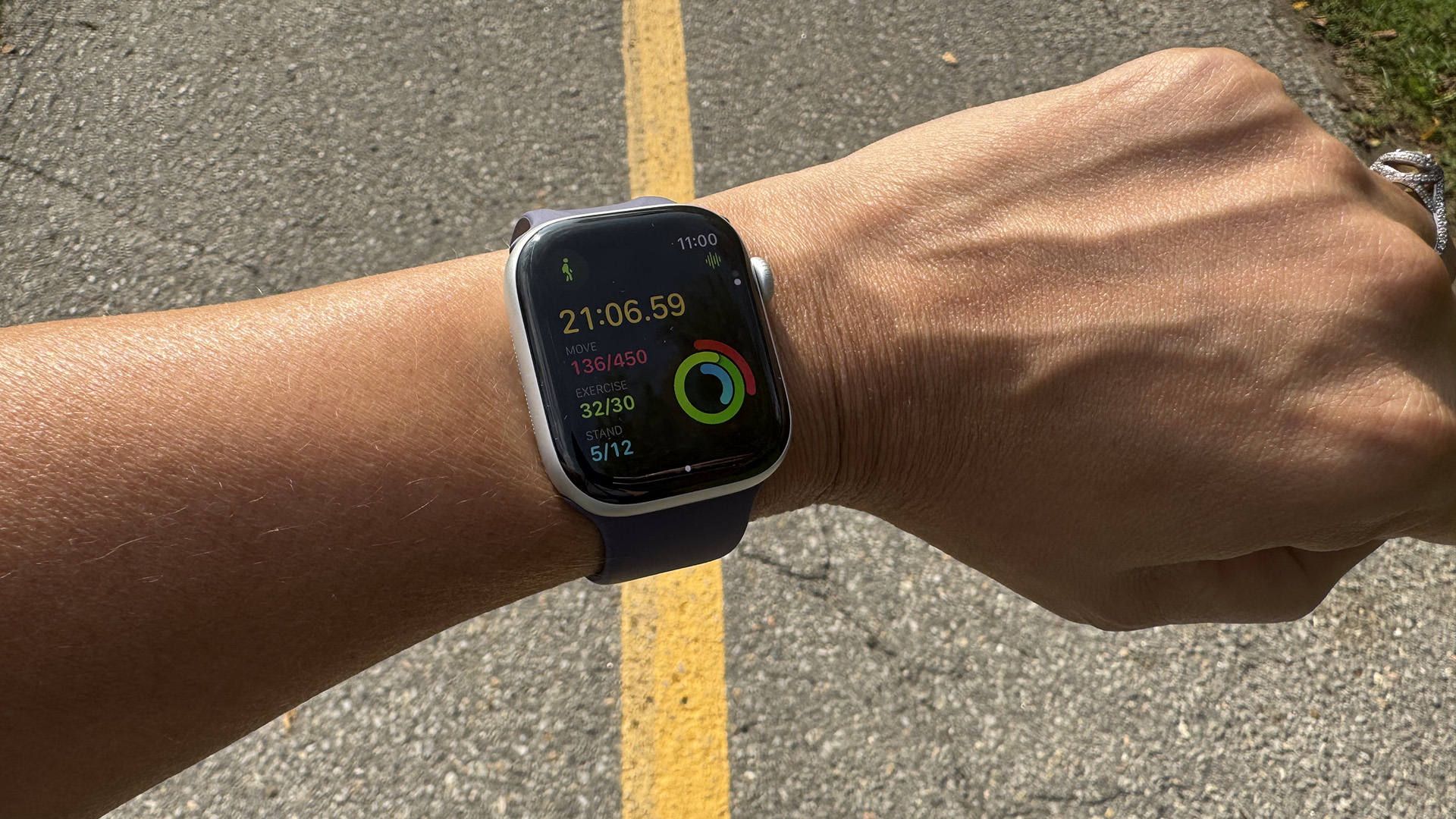 Apple Watch Series 11 on a wrist logging a walking workout.