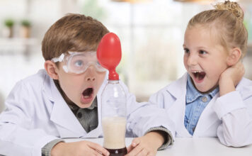 LEGO, games, and more: Top holiday gifts for kids of all ages Two kids playing with the Brainstorm Chemistry Kit.