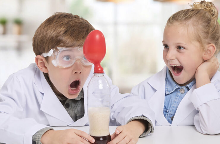 LEGO, games, and more: Top holiday gifts for kids of all ages Two kids playing with the Brainstorm Chemistry Kit.