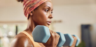 A woman training with a smartwatch on her wrist