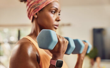 8 wellness gift ideas to stay fit and healthy this winter A woman training with a smartwatch on her wrist