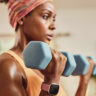 A woman training with a smartwatch on her wrist