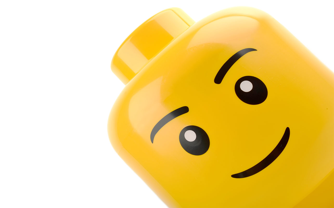 Forest Row, United Kingdom - May 5th 2015: large Lego head display figure. Shot in home studio on white.