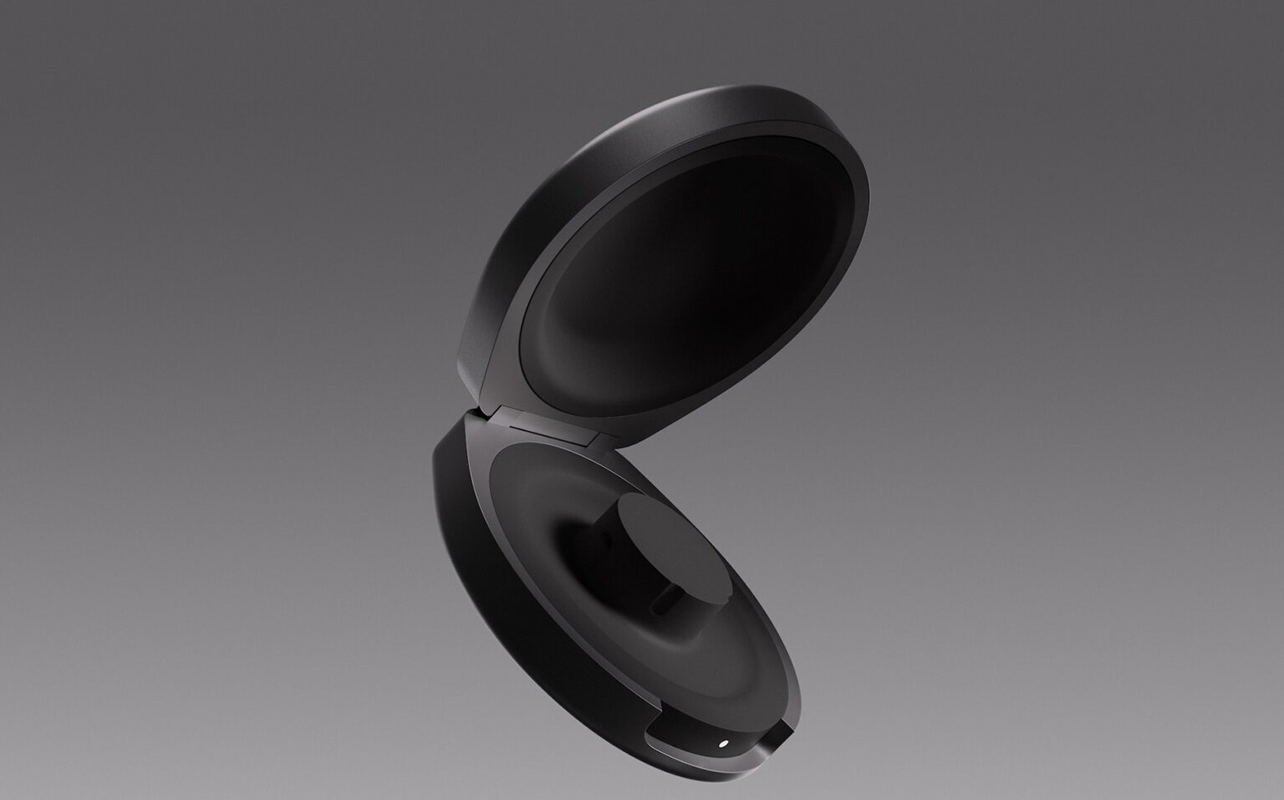 The new Oura Ring 4 charging case open and floating on a grey background.