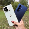 A hand holding the Google Pixel 10 Pro Fold and Samsung Galaxy Z Fold 7 outside.