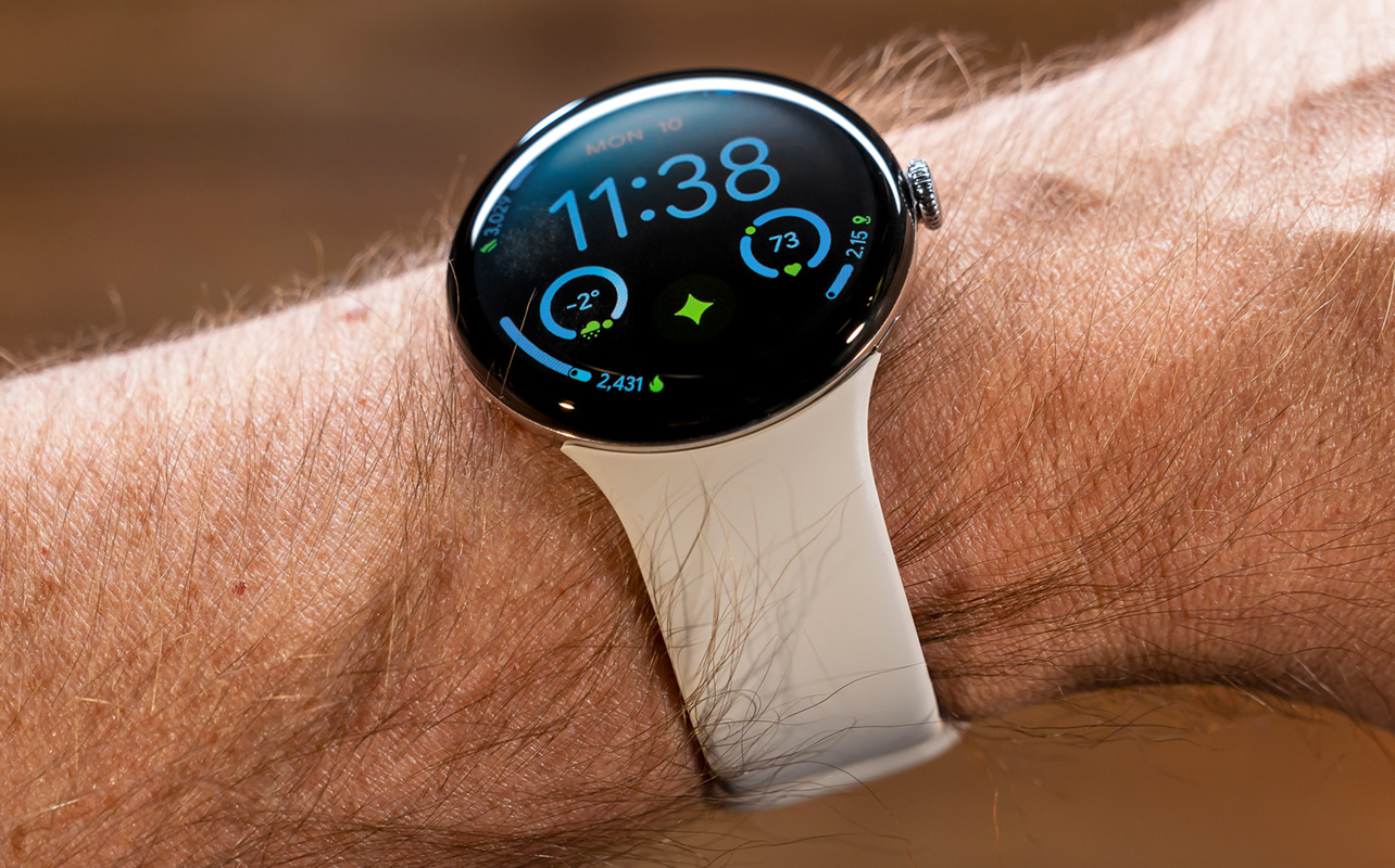 Google Pixel Watch 4 tilted to show domed screen.