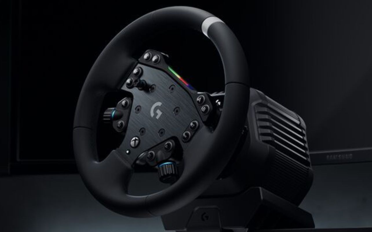 The Logitech G RS50 Racing Wheel sits lit up with a black background.