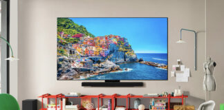 An LG C5 OLED TV mounted on a wall in a living room.