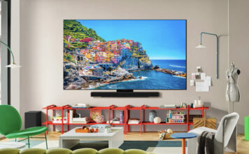 Different OLED TV technologies, explained An LG C5 OLED TV mounted on a wall in a living room.