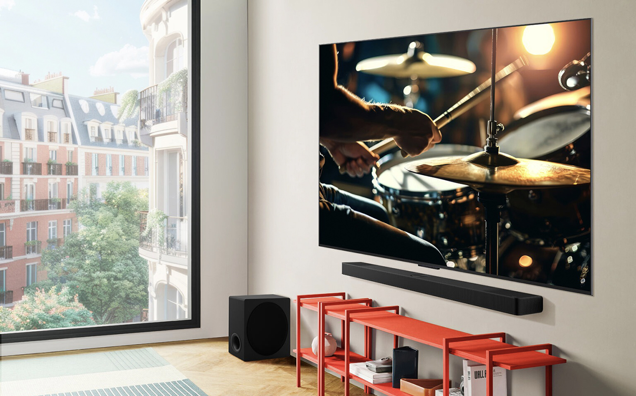 An angled shot of an LG C5 OLED mounted on a wall with a soundbar under it.