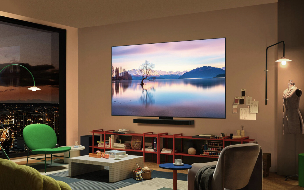 An LG C5 OLED TV mounted in a living room.