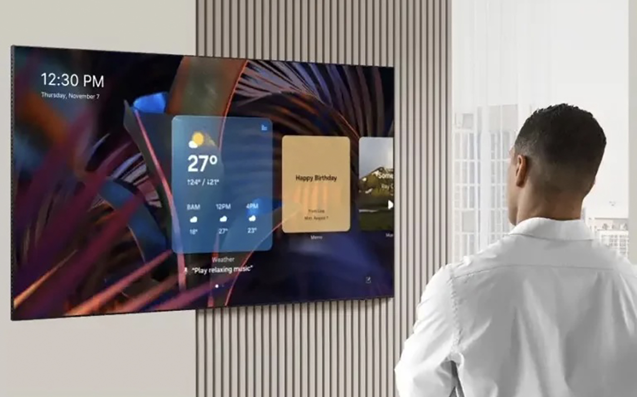 A man navigating a menu on a Samsung OLED TV