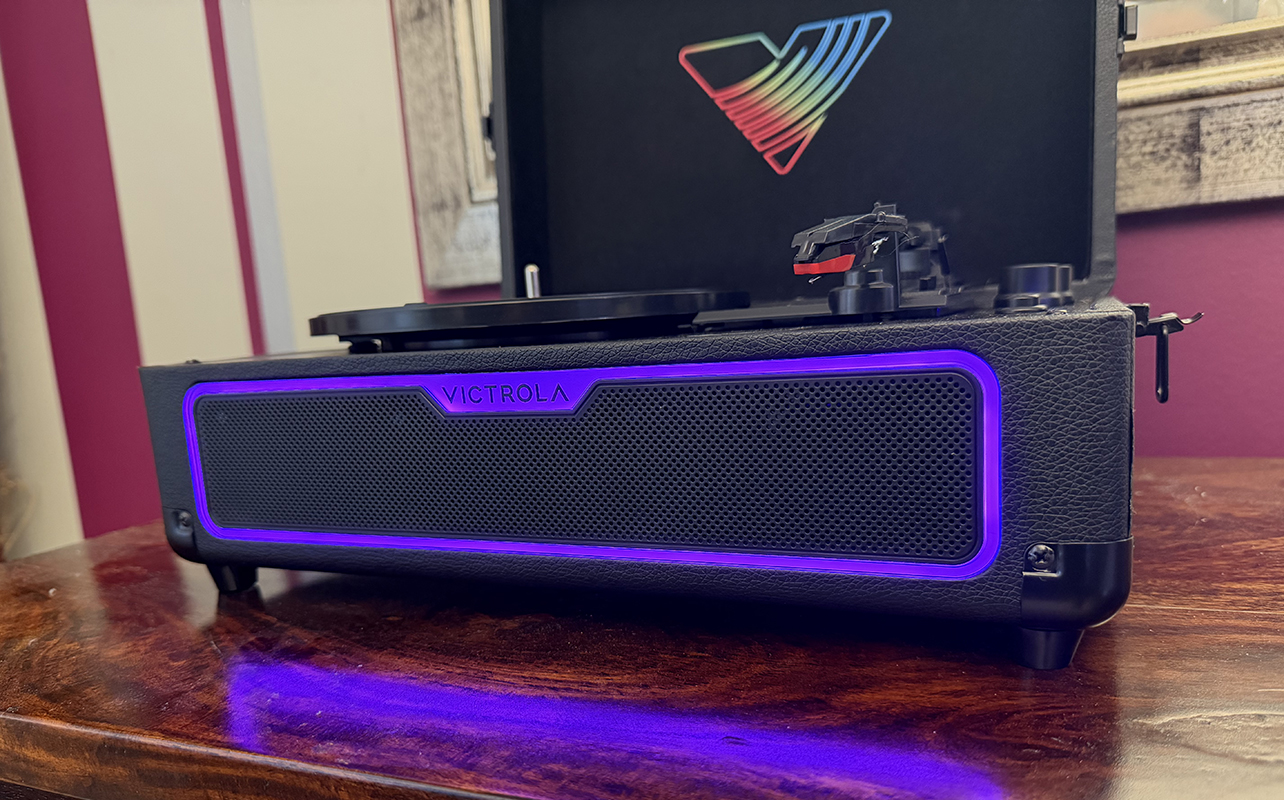 A close up of the lights on the front of the Victrola Journey Glow record player.