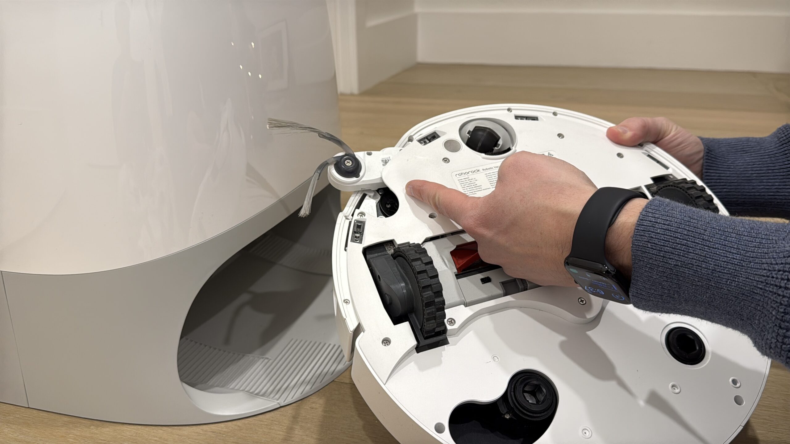 The Roborock Qrevo Curv Robot Vacuum flipped over.