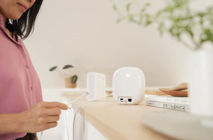 How to optimize your Nest Wi-Fi Mesh System: Placement, upgrades & tips Nest Wi-Fi Mesh is getting connected by a user.