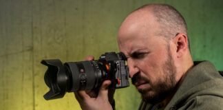 Holding the Sony A7 V in hand ready to shoot.