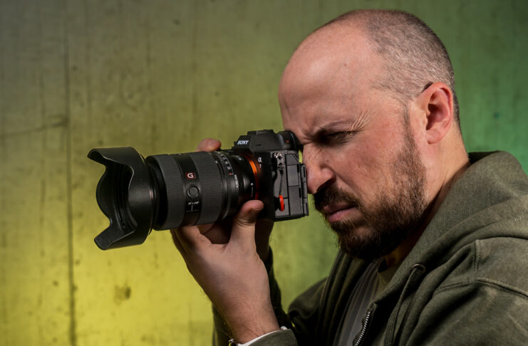 Holding the Sony A7 V in hand ready to shoot.