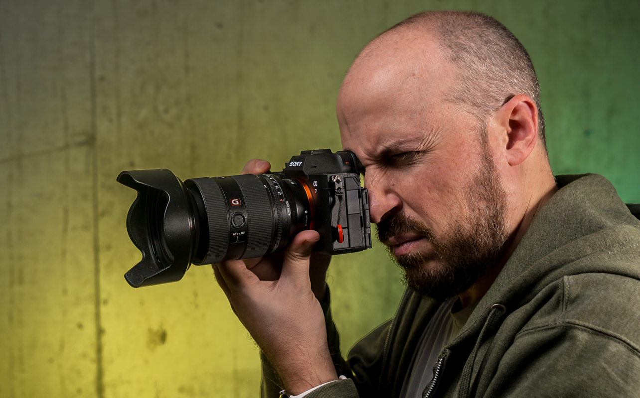 Holding the Sony A7 V in hand ready to shoot.