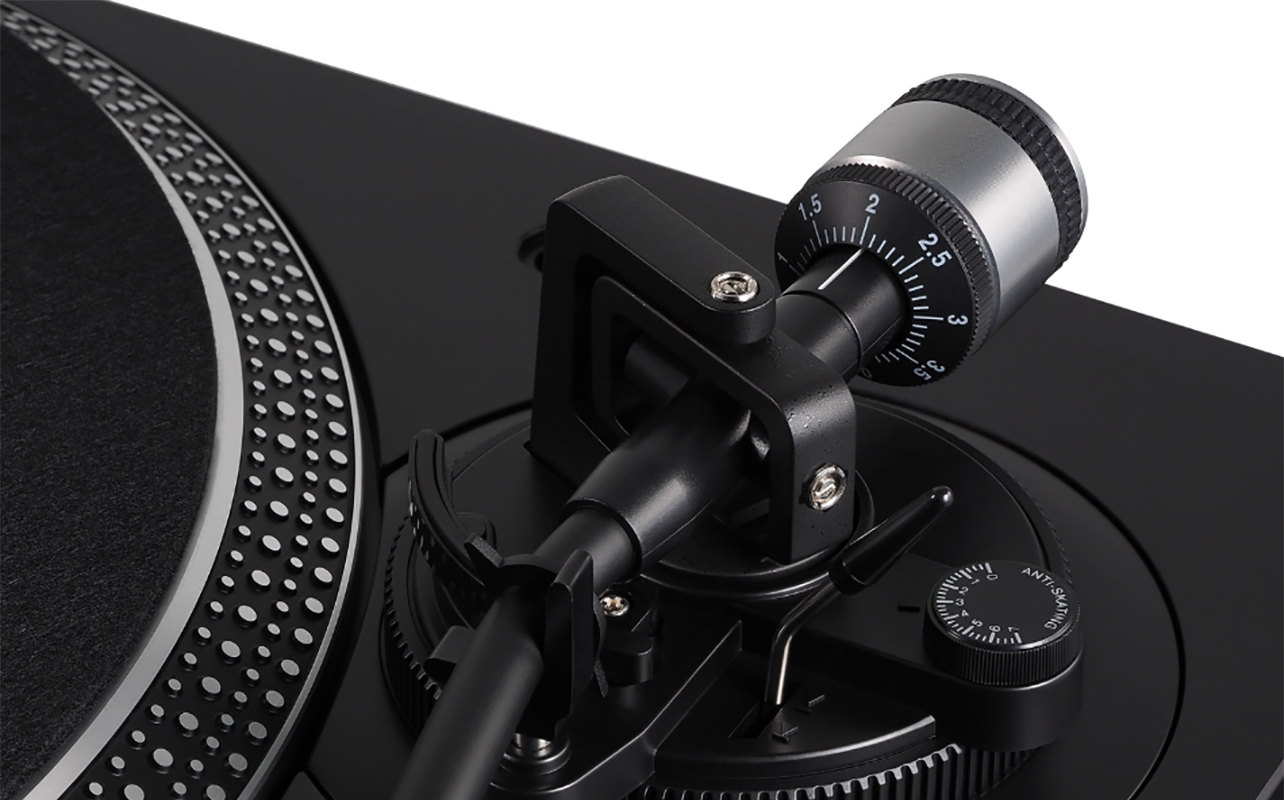 A close-up of an Audio Technica turntable tonearm.