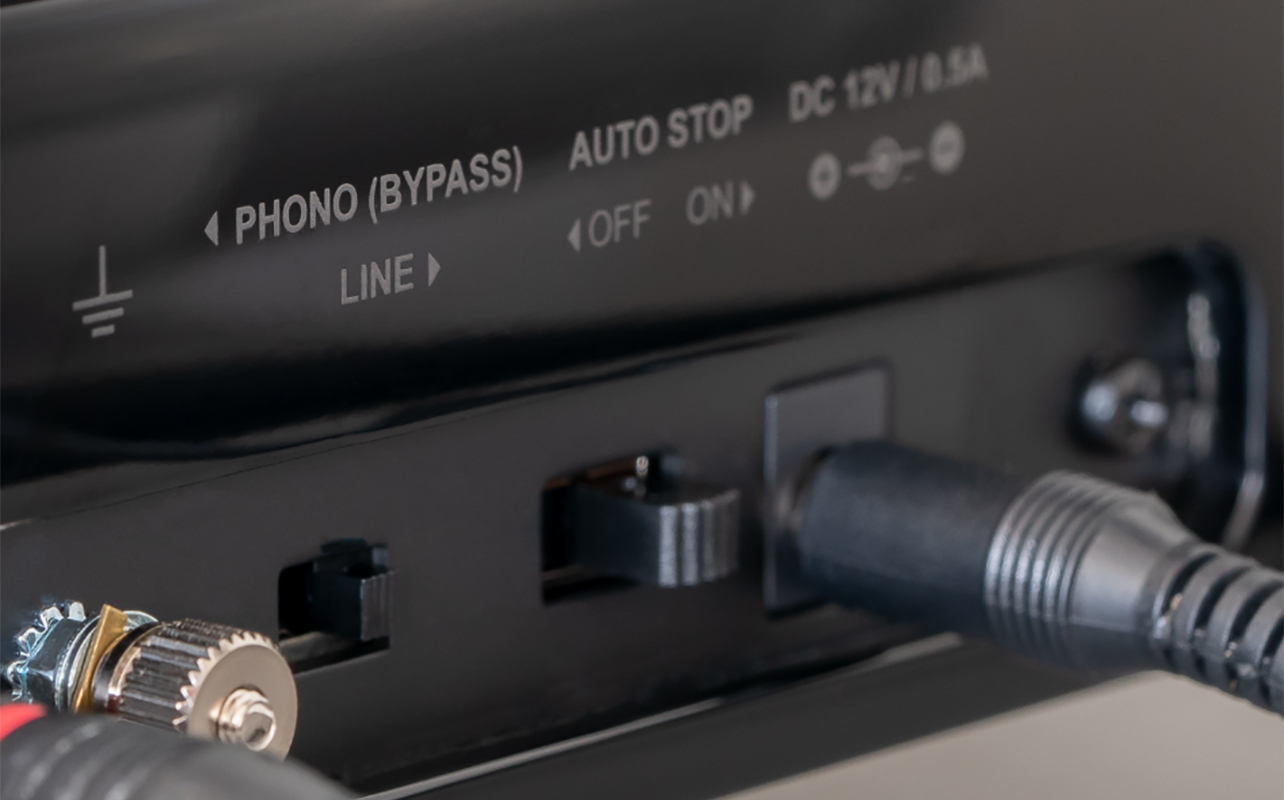 The back of a Fluance turntable showing ports.