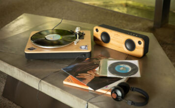 A House of Marley Stir It Up turntable with a speaker.