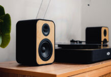 Vinyl setup basics: Do record players need speakers? House of Marley Stir It Up Revolution turntable on a stand with speakers.