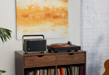 Record player setup: Step-by-step guide for beginners JBL USB Bluetooth turntable set up on furniture beside a speaker.