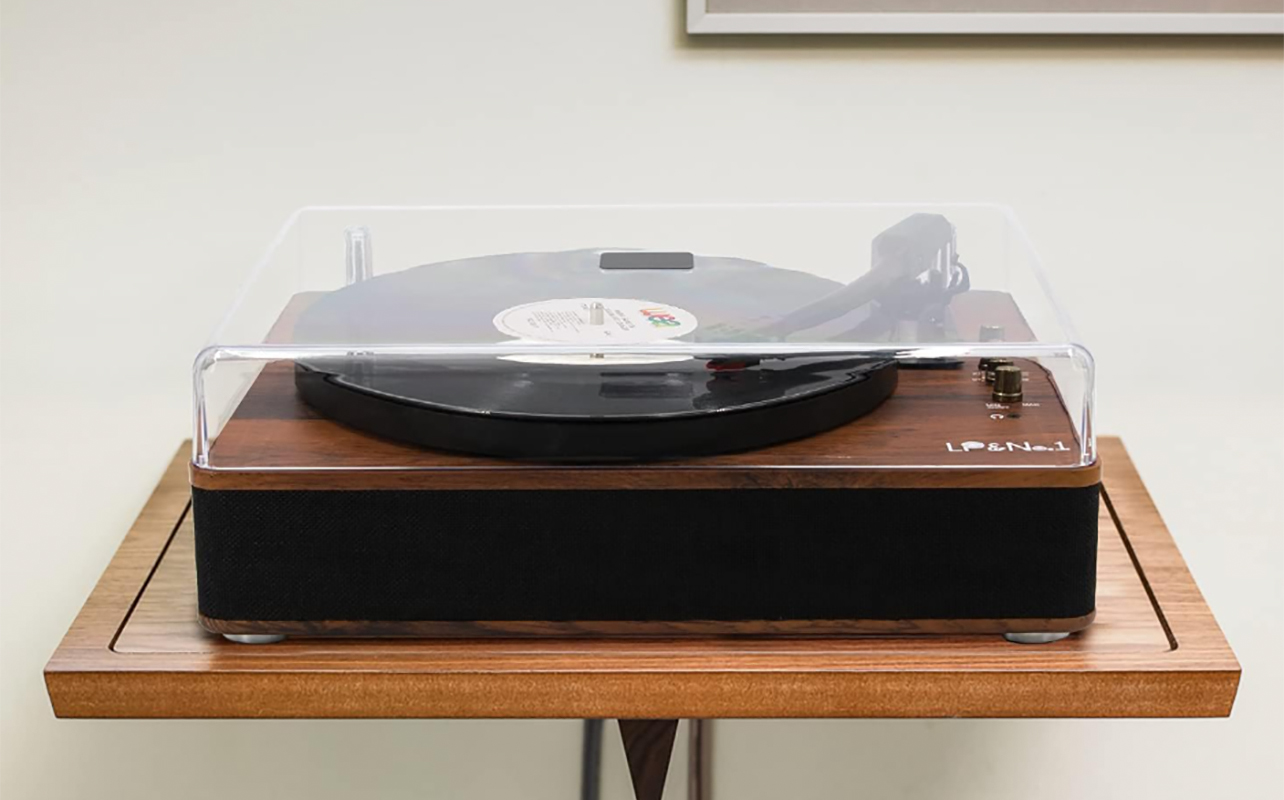 An LP No 1 record player on a stand with the dust cover closed.