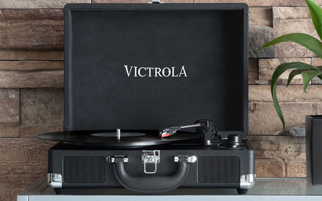 The Victrola Journey Bluetooth turntable open on a table.