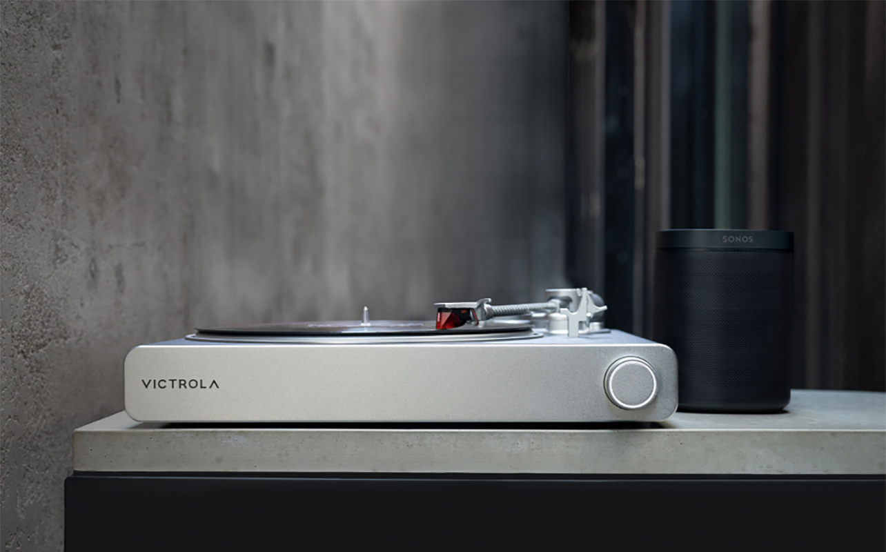 Victrola Stream Carbon beside a Sonos speaker