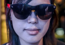 Everybody’s wearing smart glasses at CES 2026 Woman wearing smart glasses looking ahead at CES 2026.