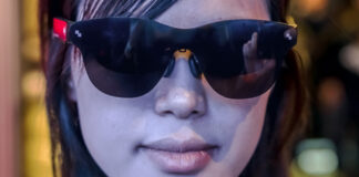 Woman wearing smart glasses looking ahead at CES 2026.