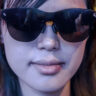 Woman wearing smart glasses looking ahead at CES 2026.