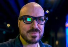 RayNeo X3 Pro AR glasses on face with visible visual screen on right eye.