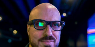 RayNeo X3 Pro AR glasses on face with visible visual screen on right eye.