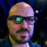 RayNeo X3 Pro AR glasses on face with visible visual screen on right eye.