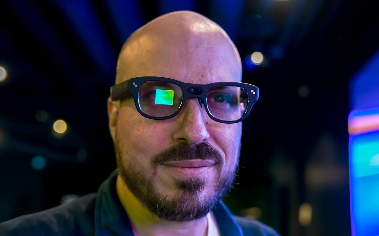 RayNeo X3 Pro AR glasses on face with visible visual screen on right eye.