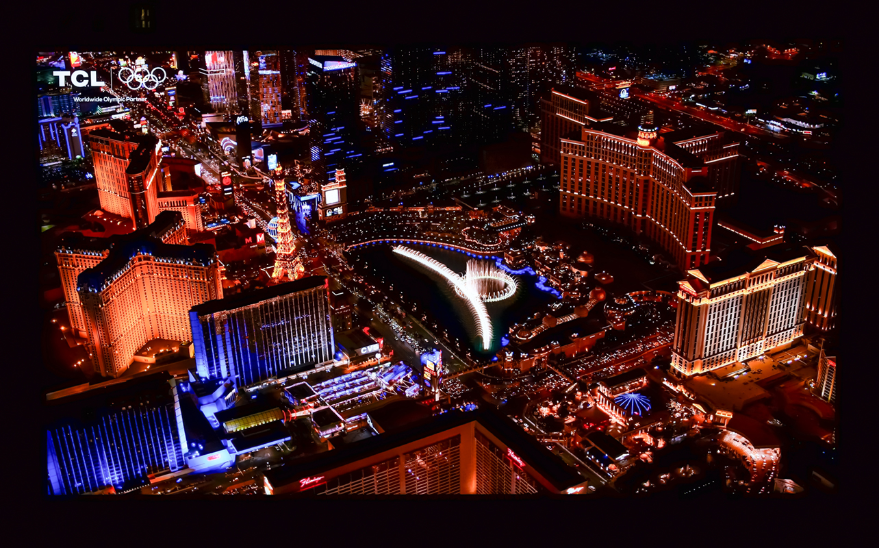 TCL X11L SQD Mini-LED TV with night city scene.