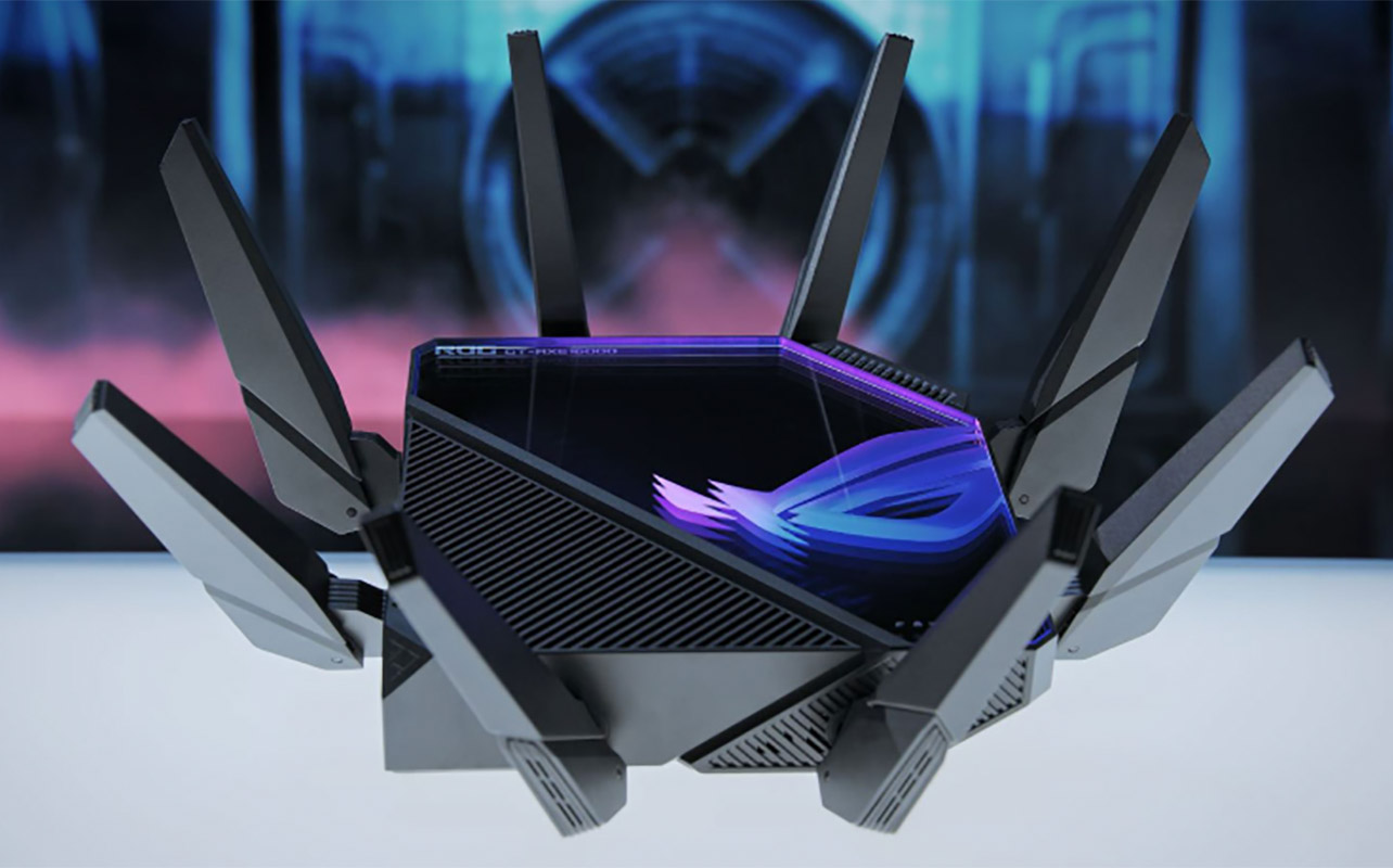 An Asus ROG Rapture router with a colourful image in the background.
