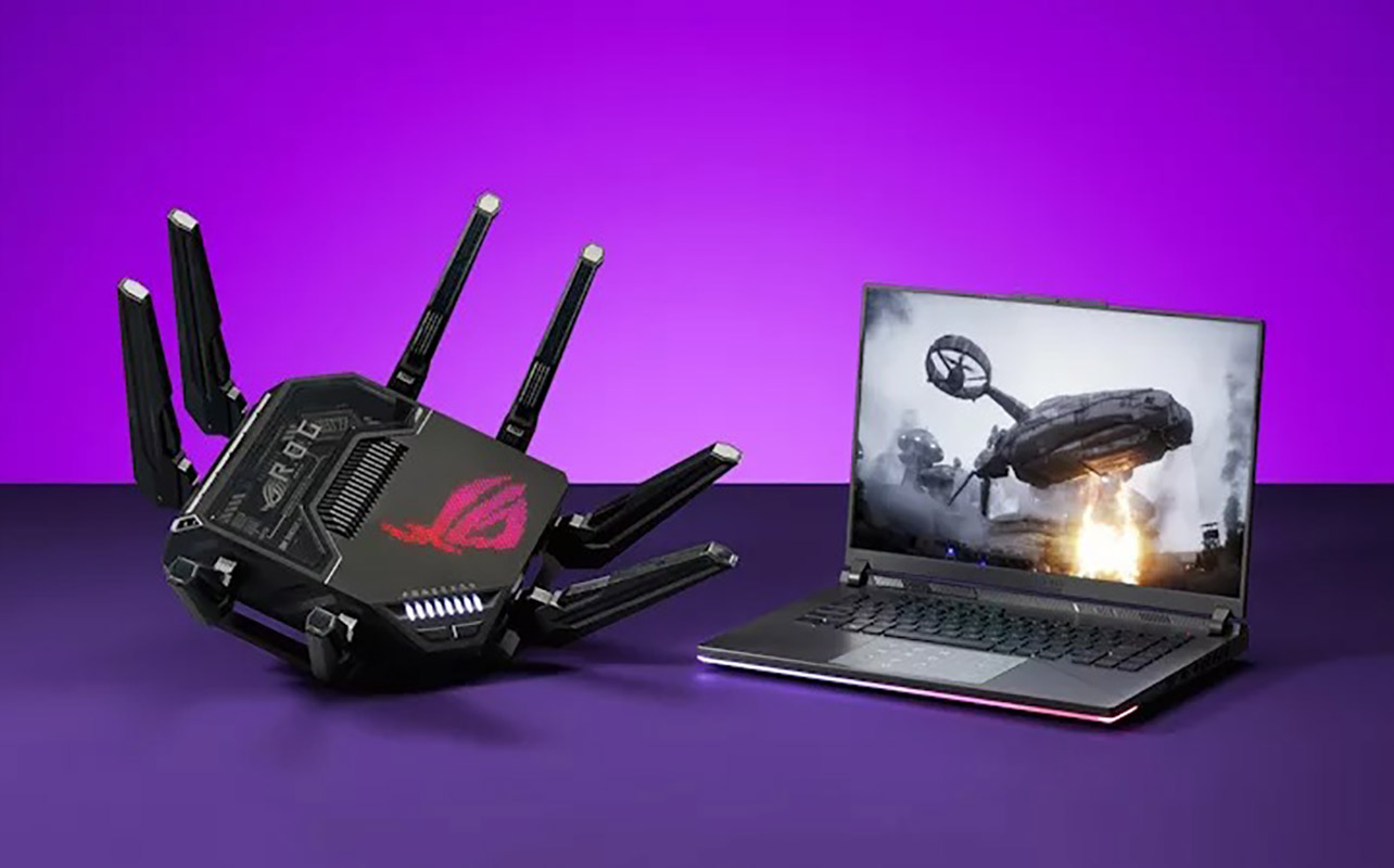 An Asus ROG router with a laptop.