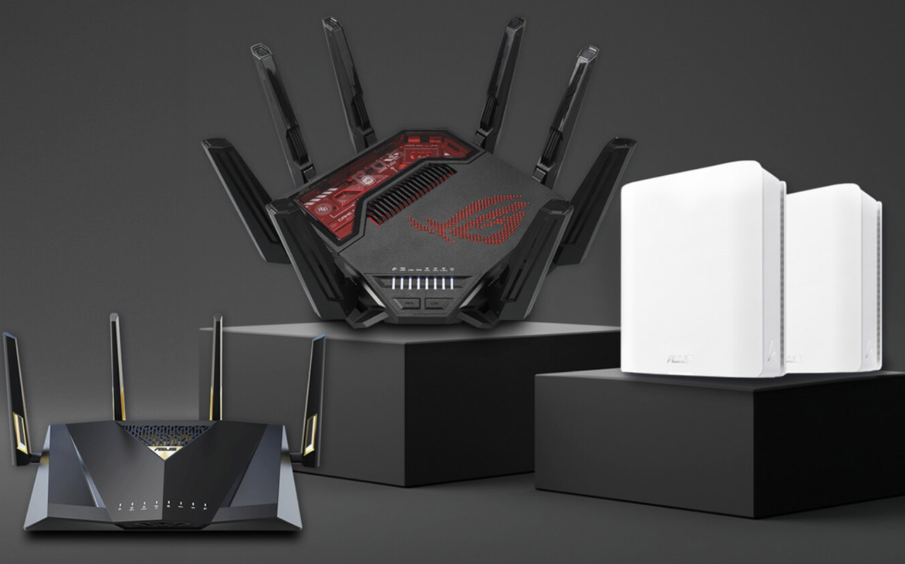 Three Asus routers atop boxes.
