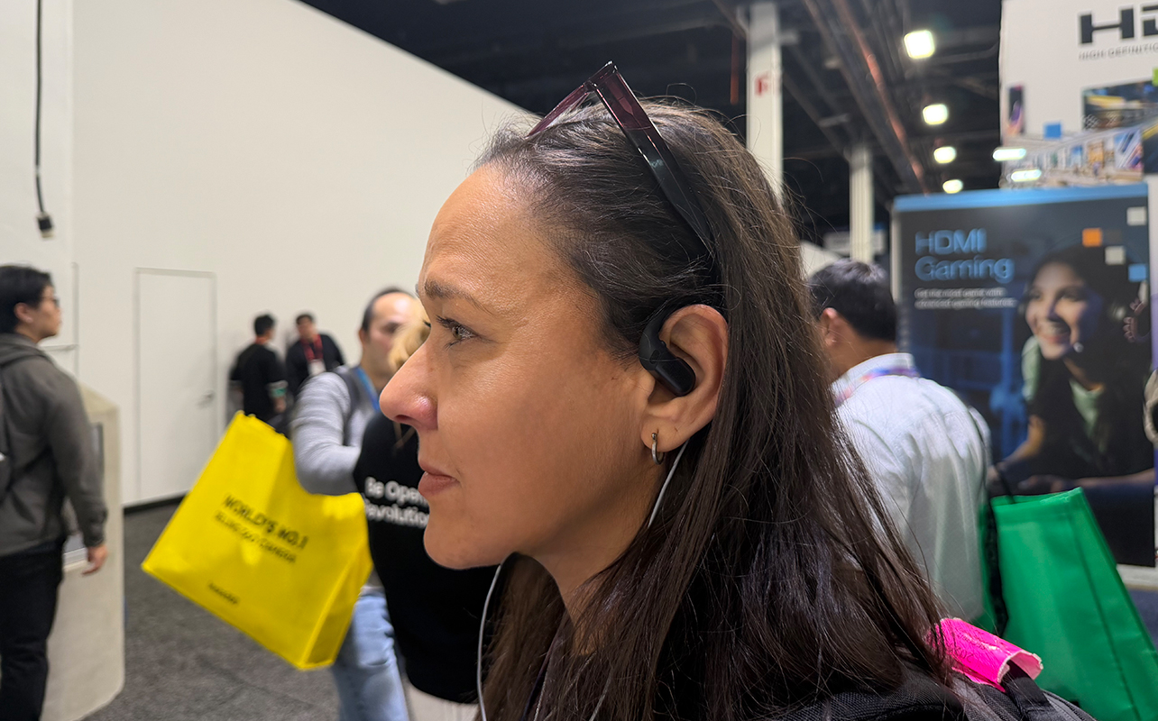 Shokz OpenFit Pro on a woman