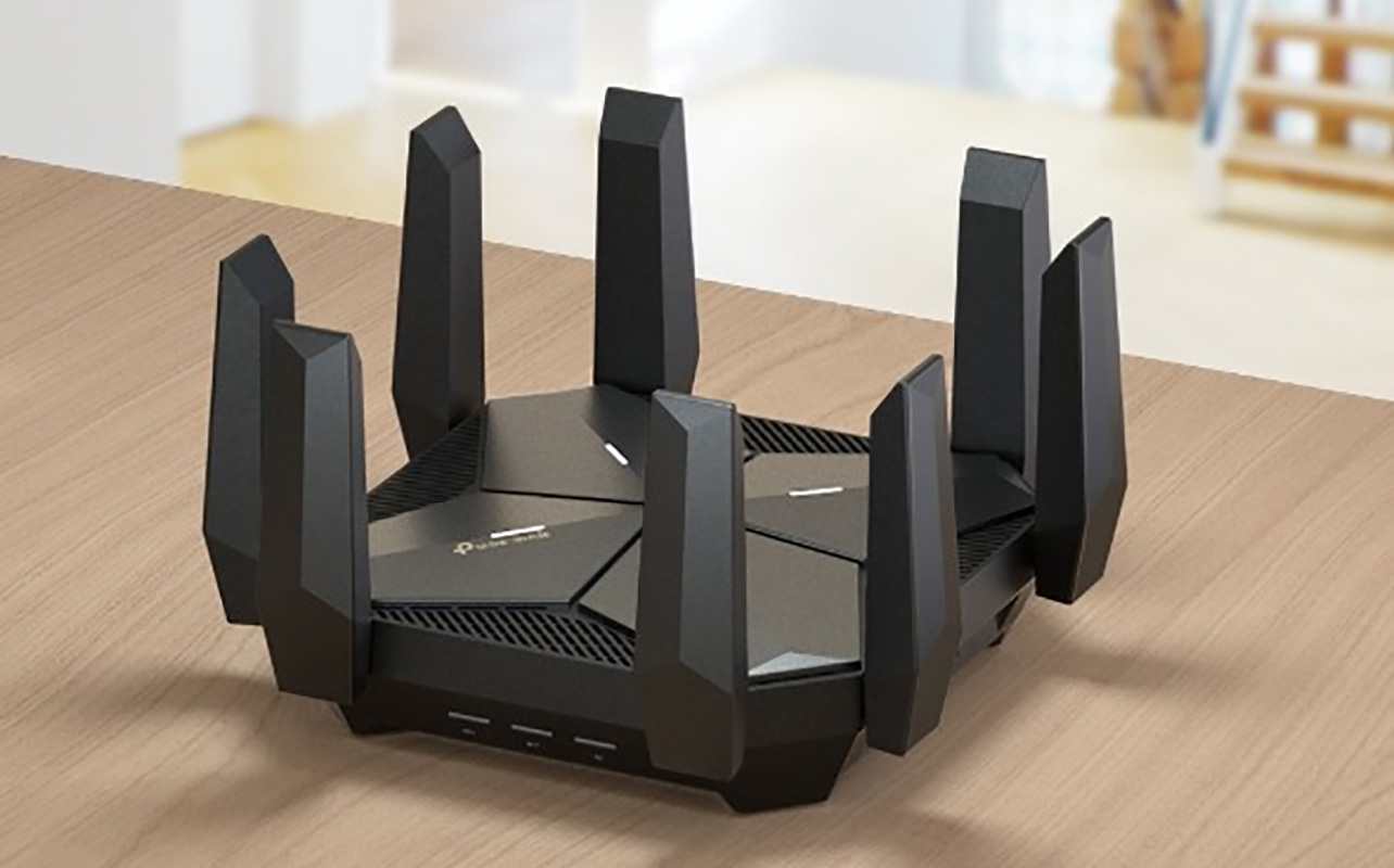 An Archer AXE300 router on a table.