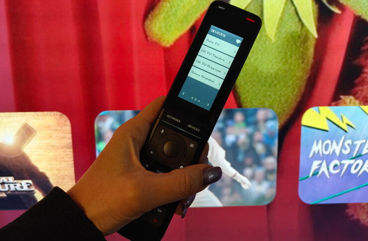 A smarter universal remote for busy living rooms: One For All Smart Pro Touch review One For All Smart Pro Touch remote in front of a TV.