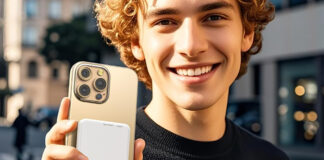 A young man holding a Szfakeur power bank.