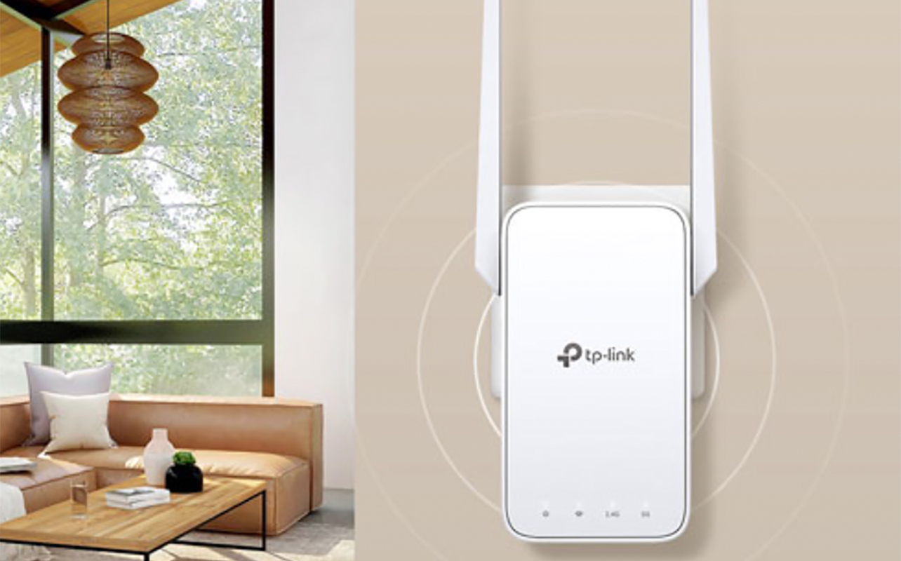 A TP-Link AC1200 range extended mounted on the wall on the right with a kitchen view on the left.